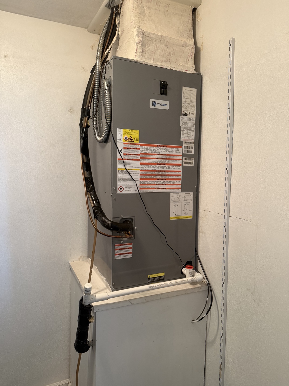 Indoor HVAC system being serviced