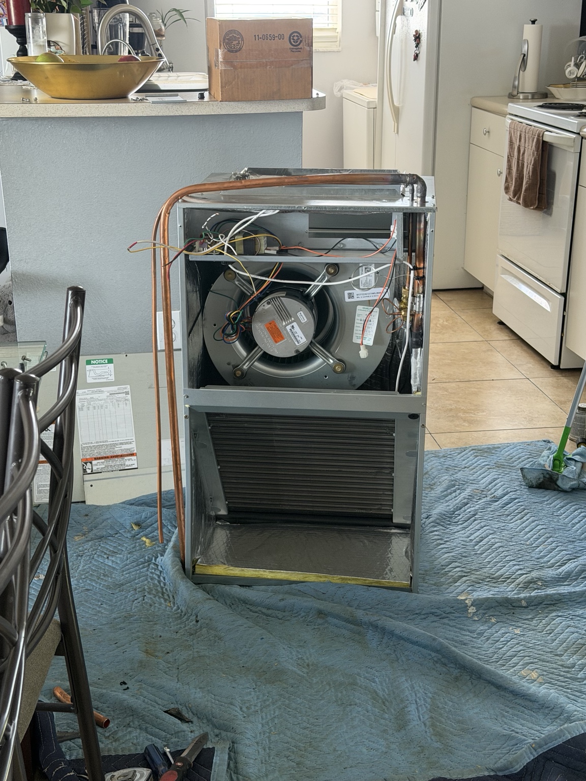 Breeze Air technician repairing an indoor air handler